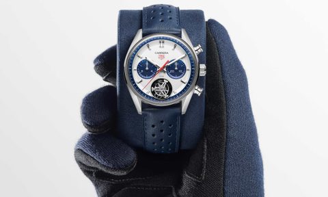 person with gloves holding Blue Panda Carrera Chronograph watch