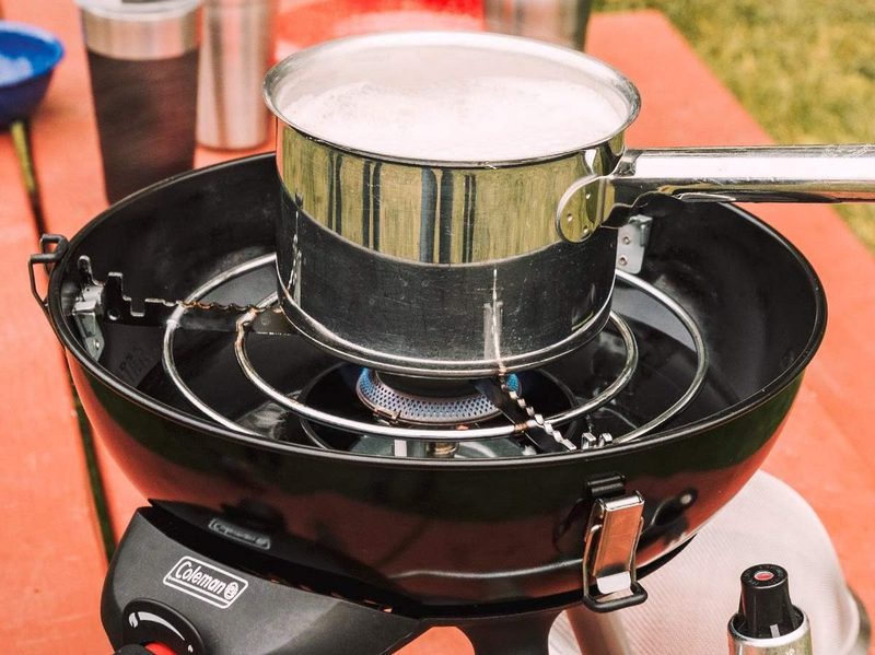 Boiling a pot of water on the Coleman 4-in-1 Portable Propane Camping Stove.