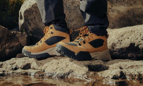 Hiking boots standing on rocks