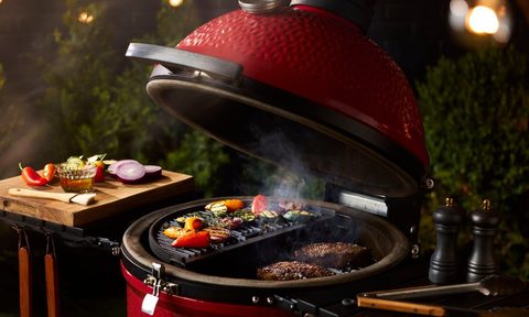 An opened Classic Joe III with food cooking, from Kamado Joe.