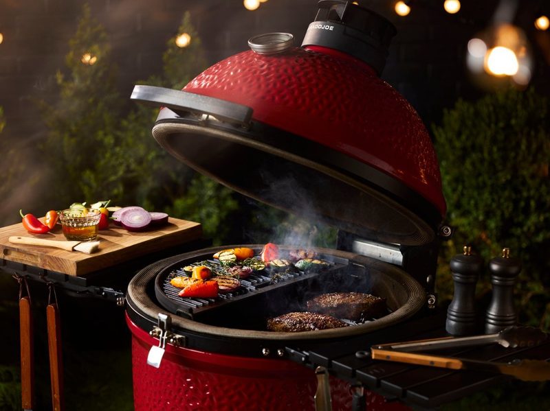 An opened Classic Joe III with food cooking, from Kamado Joe.