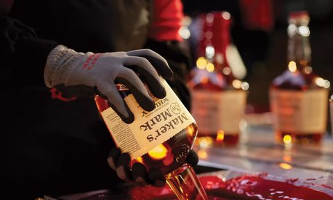 Maker's Mark bottle wax dipping the seal