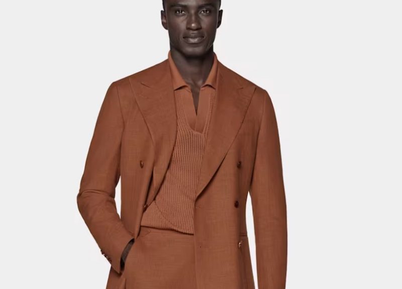 Man in orange double breasted from Suit Supply