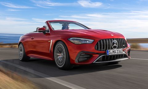Mercedes-AMG CLE 53 4MATIC+ Cabriolet driving on an ocean-side highway.
