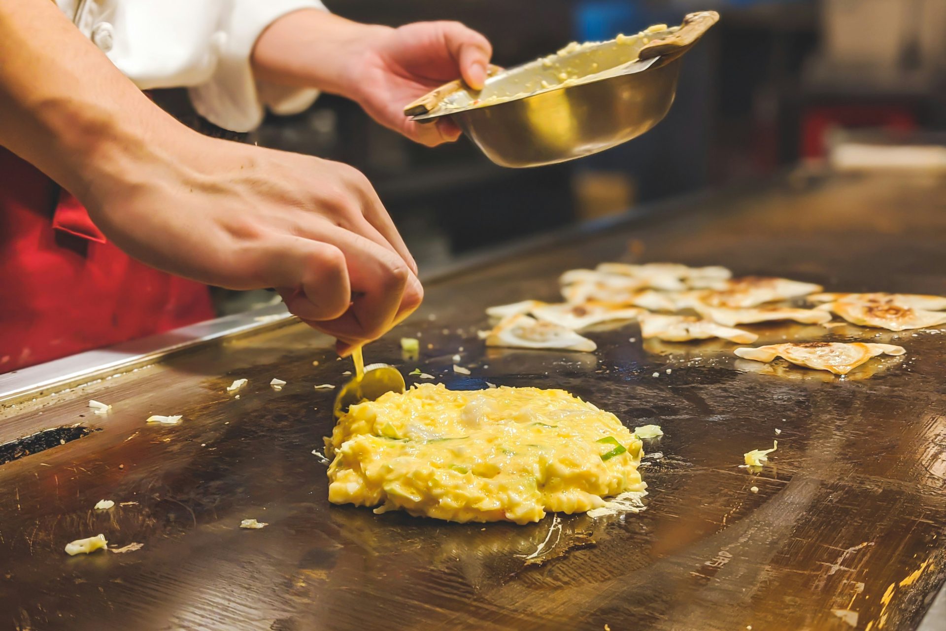 Okonomiyaki being cooked