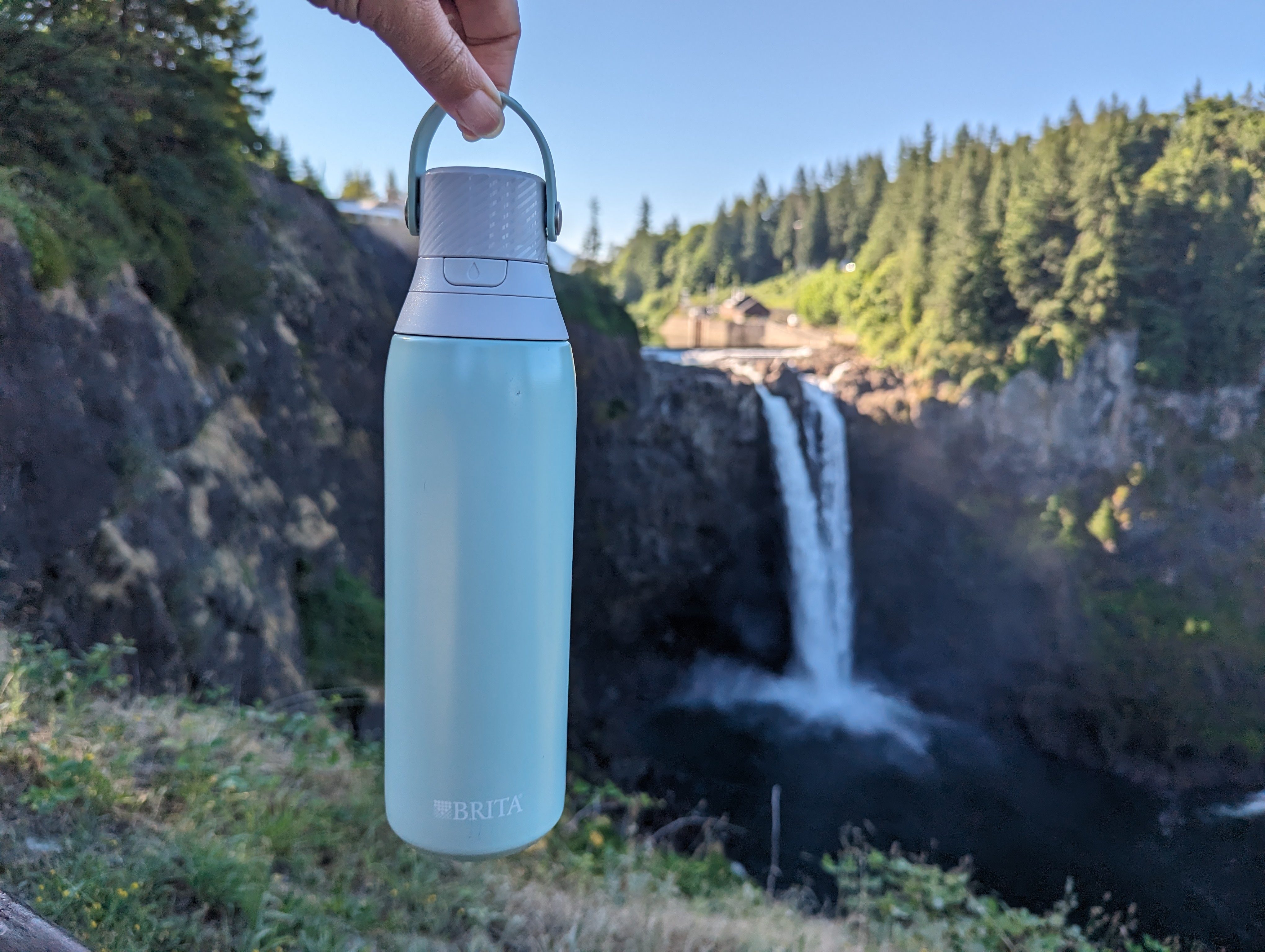 Holding a Brita Filter Water Bottle next to a waterfall
