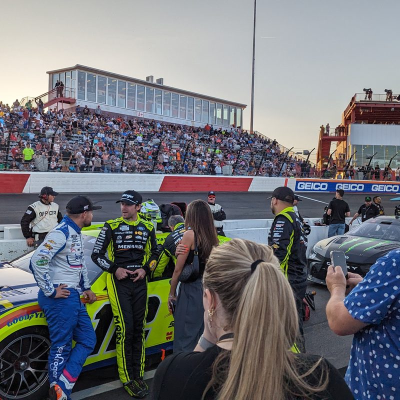Fans meeting and greeting a driver NASCAR infield
