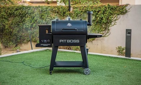 The Pit Boss 850 Competition Series Pellet Grill being used in a yard.