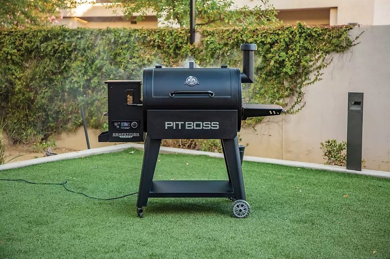The Pit Boss 850 Competition Series Pellet Grill being used in a yard.