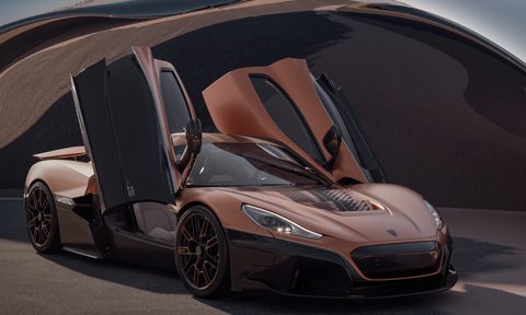 Rimac Nevera 15th anniversary edition right front three-quarter view with wing doors raised.