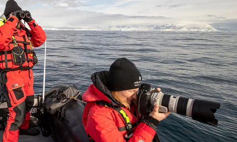 Photographers onboard a Seabourn expedition