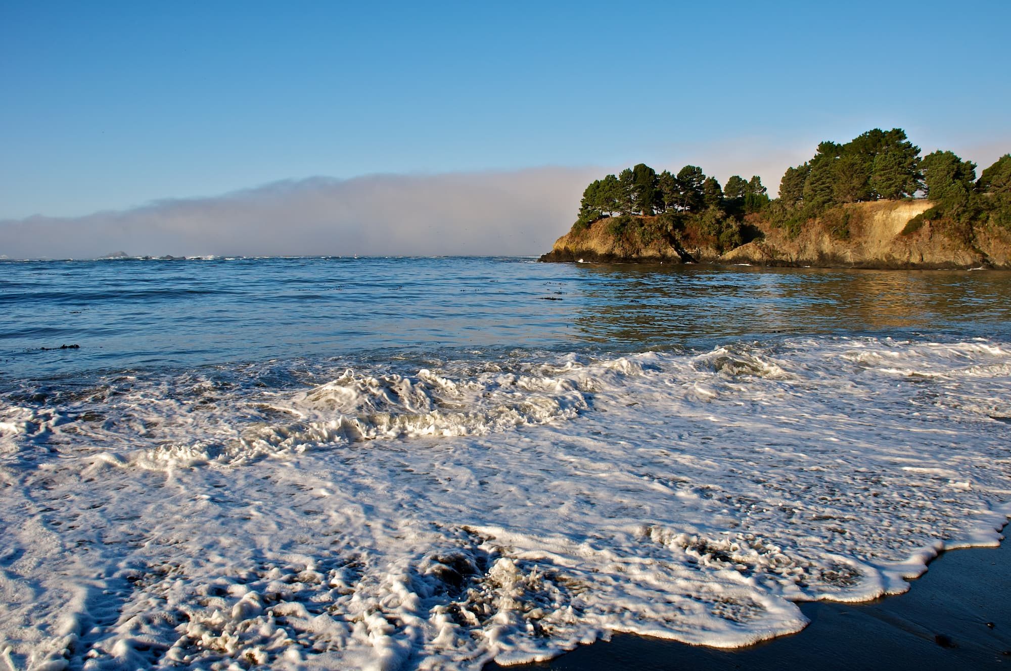 ocean with hills in background