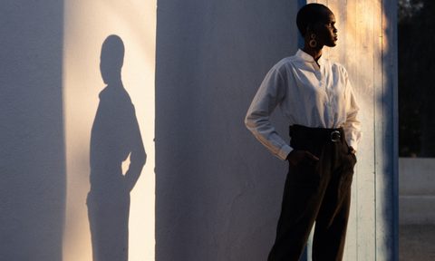 Woman in doorway with shadow