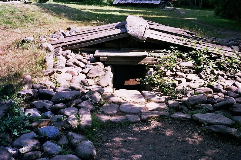 wooded area with rocks and grass