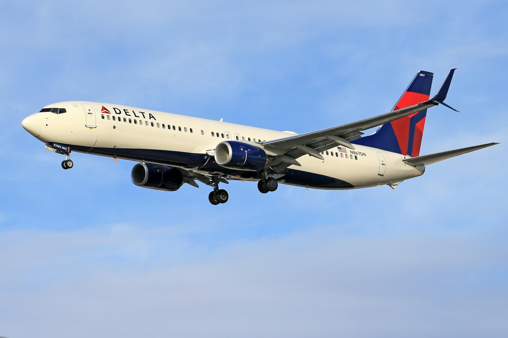 a Delta plane flying in the sky