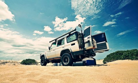 White Jeep camping in the Australian desert.