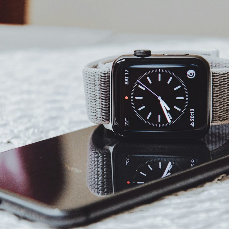 Apple Watch sitting on top of phone