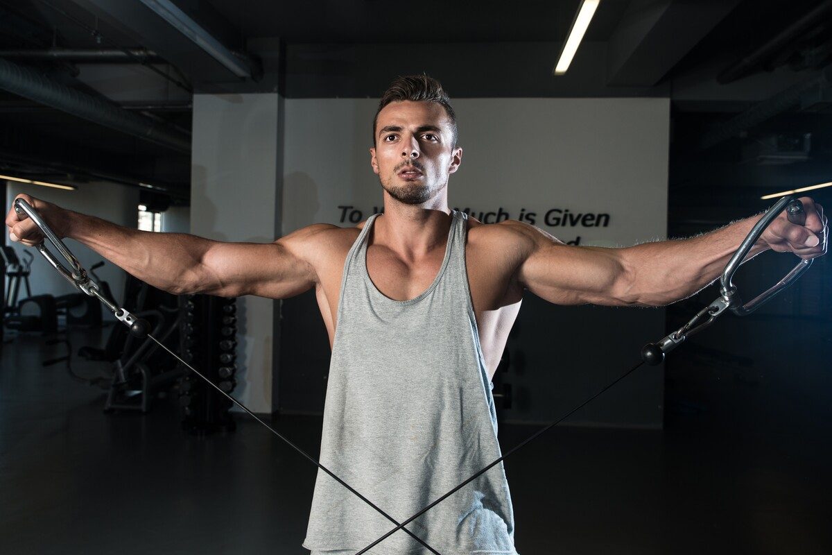 Man doing cable lateral raises.