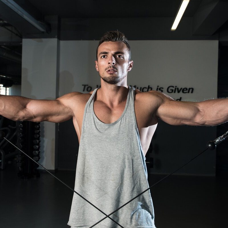 Man doing cable lateral raises.
