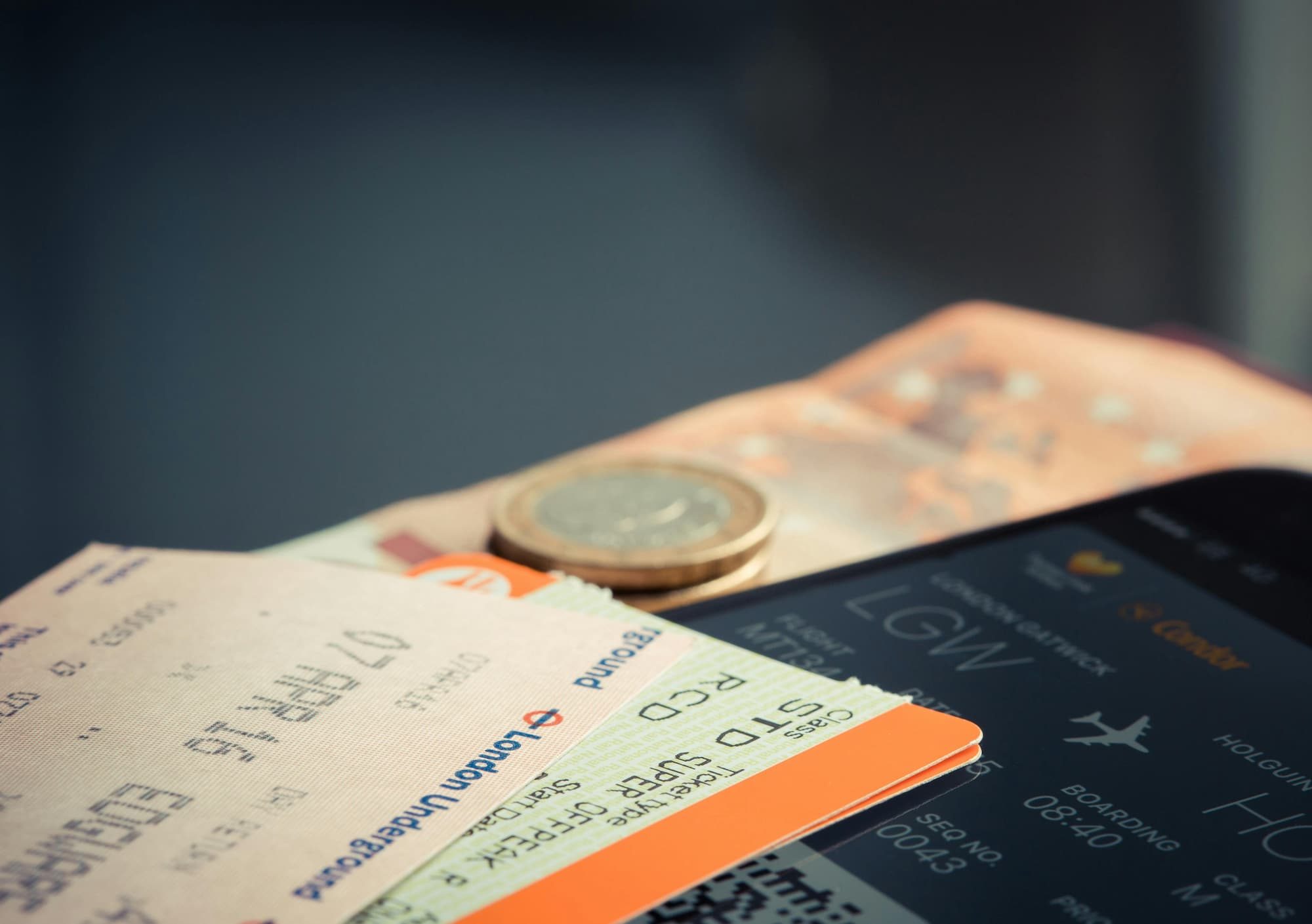 flight ticket and phone app with flight information on it