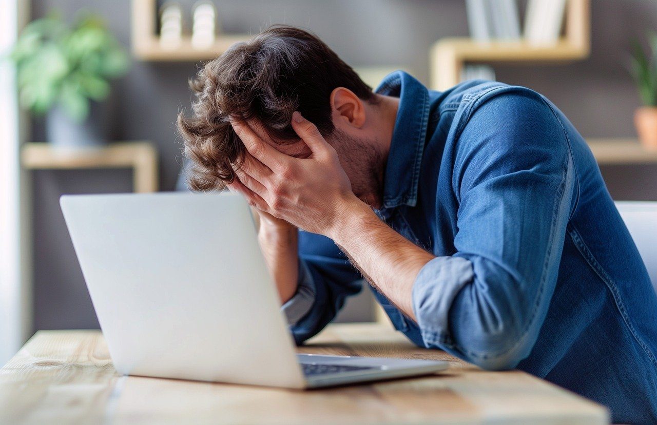 Frustrated man on laptop
