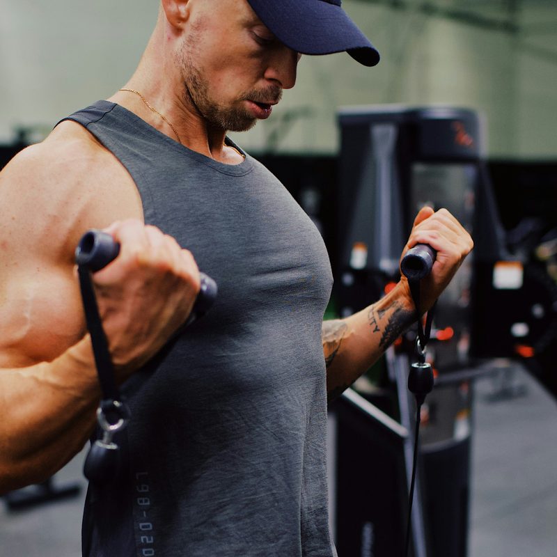Man doing cable curls.