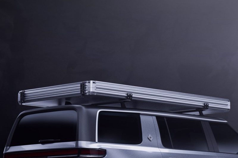 Closed Hardsider HardTent mounted atop a silver SUV.