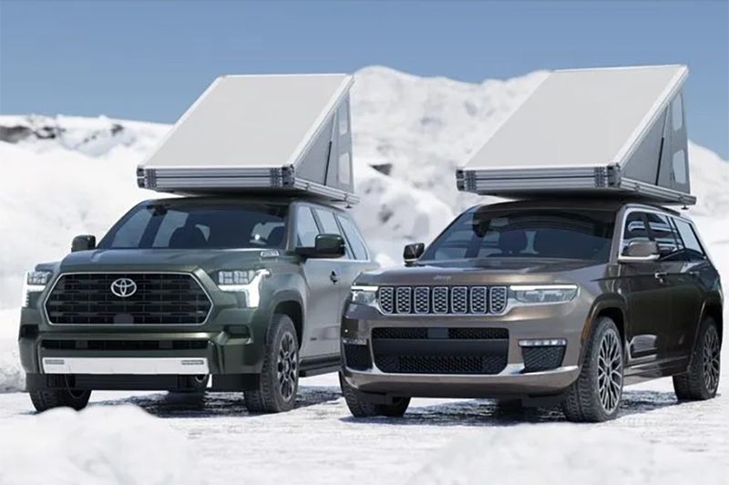 Two SUVs fitted with Hardsider HardTent rooftop tents.