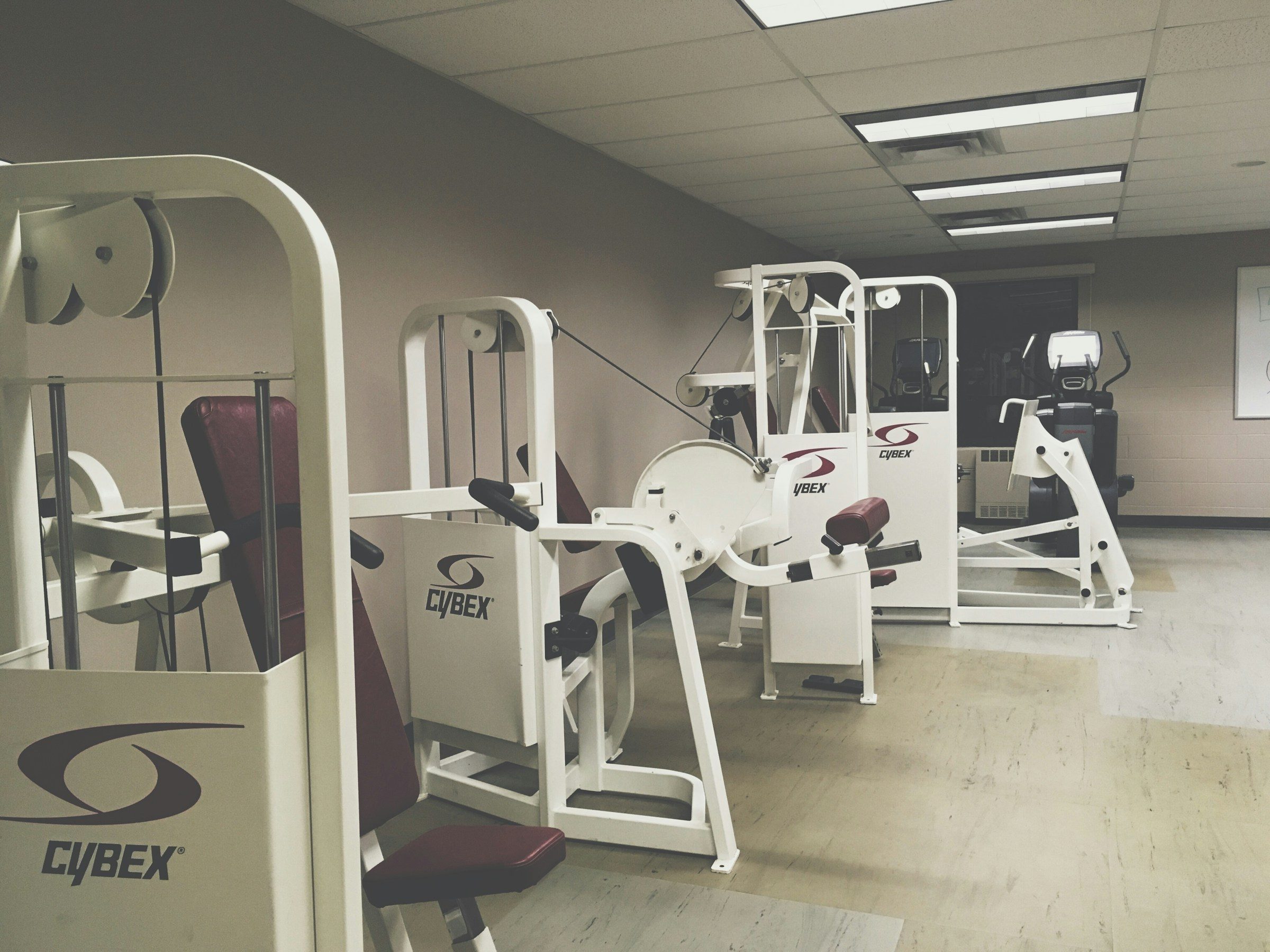 Leg machine at gym for leg curl seated