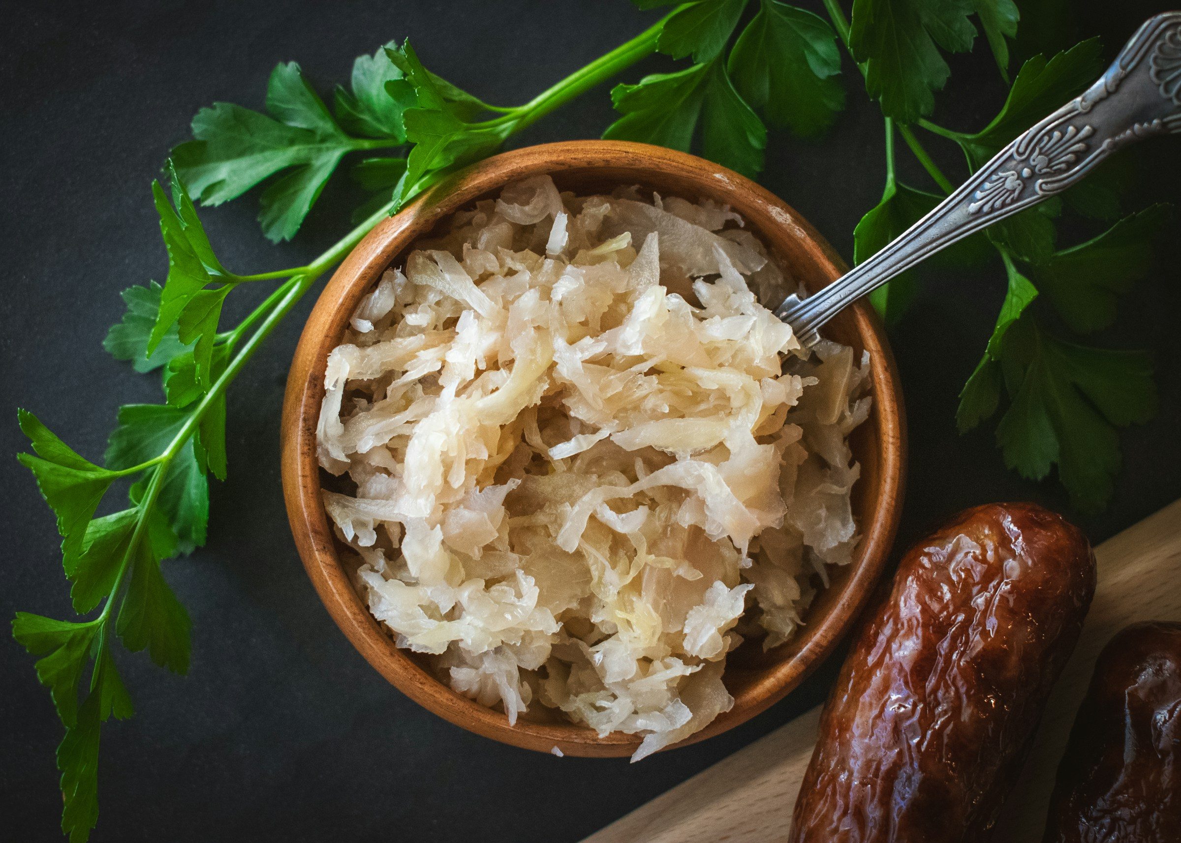 Sauerkraut in a bowl with a spoon