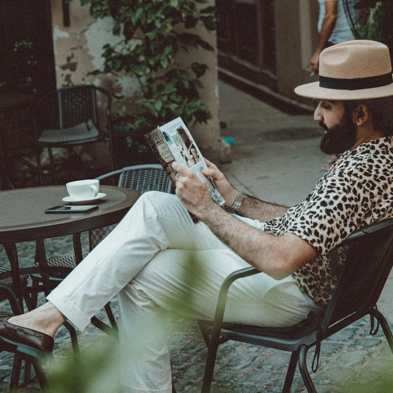 Man in fedora at a cafe