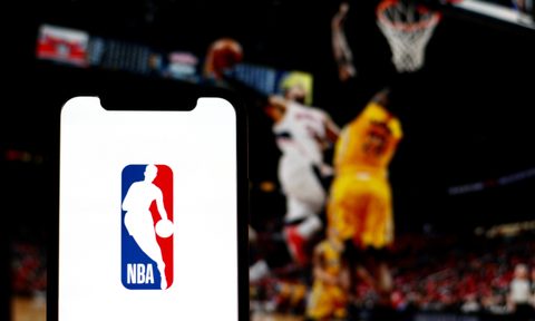 the logo of NBA is displayed on a smartphone screen