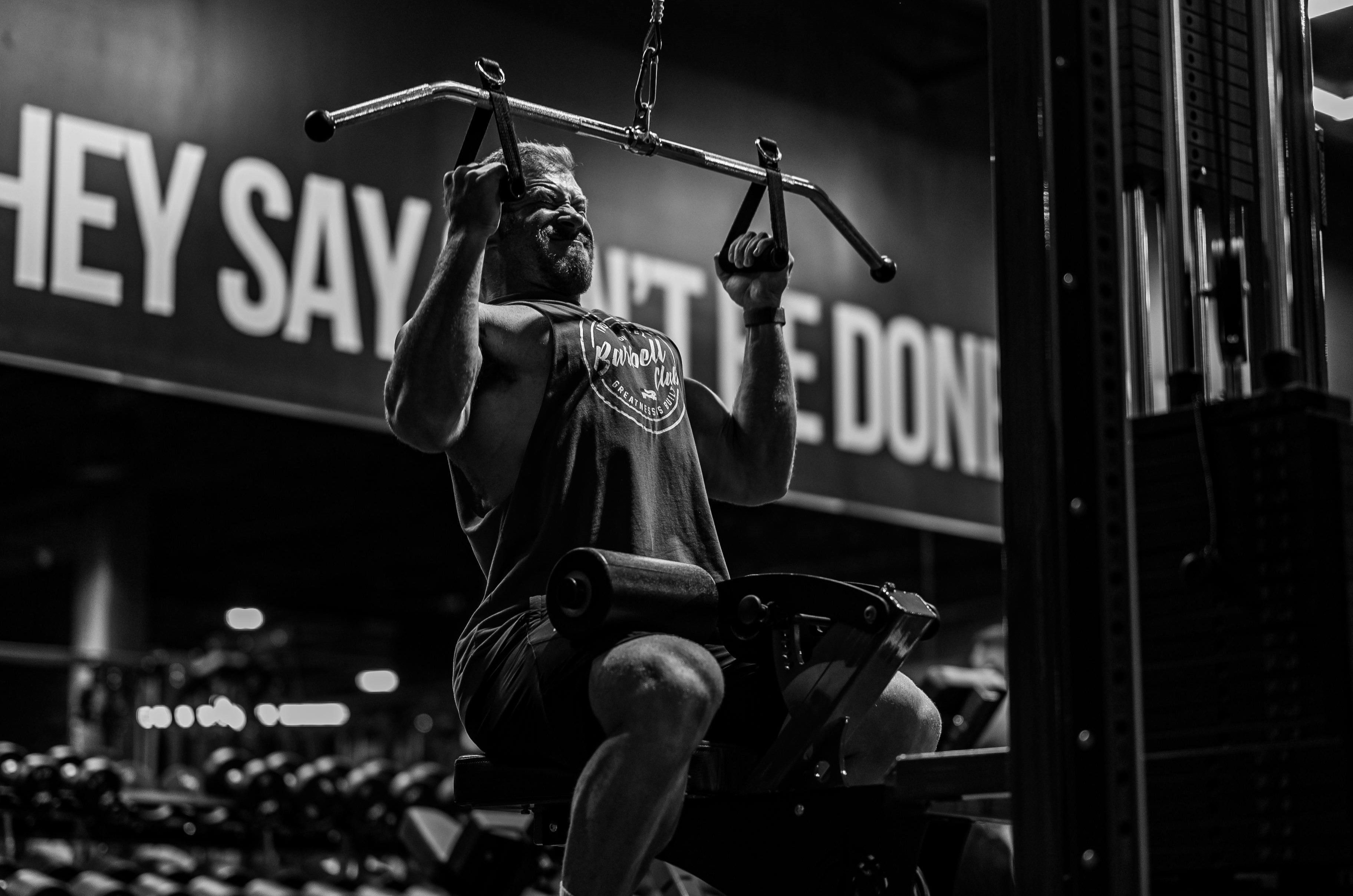 Man doing lat pulldowns.