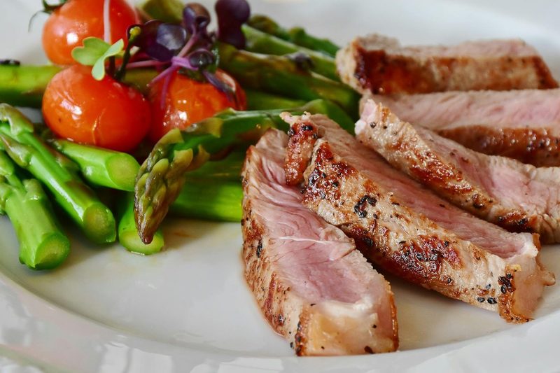 Dinner plate with cooked meat and vegetables