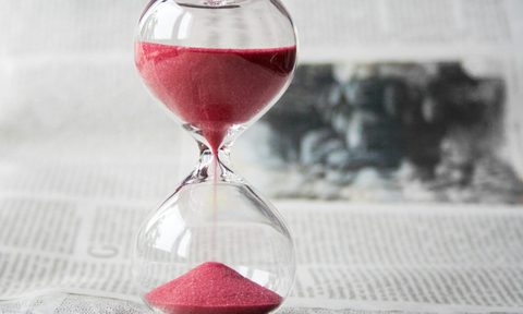 Hour glass timer on table