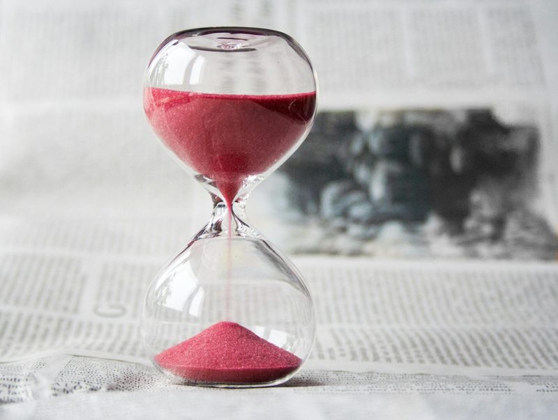 Hour glass timer on table
