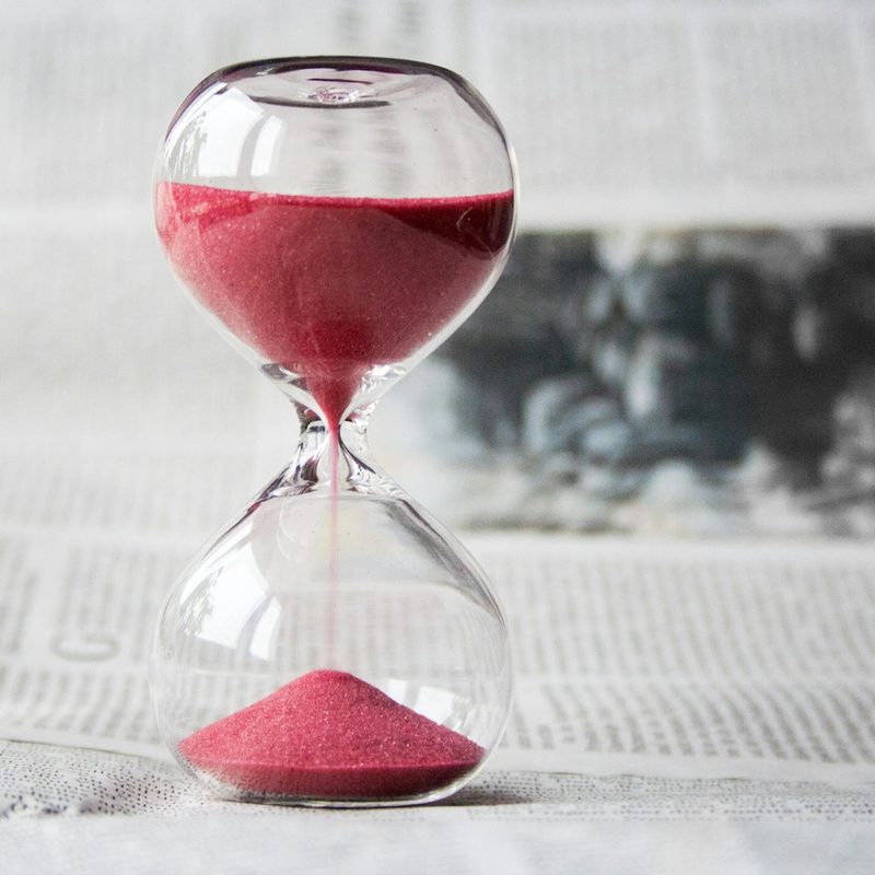 Hour glass timer on table