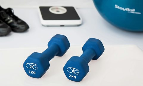 weights and ipad on white floor