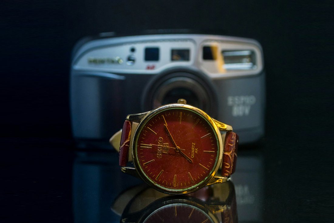 red watch in front of camera