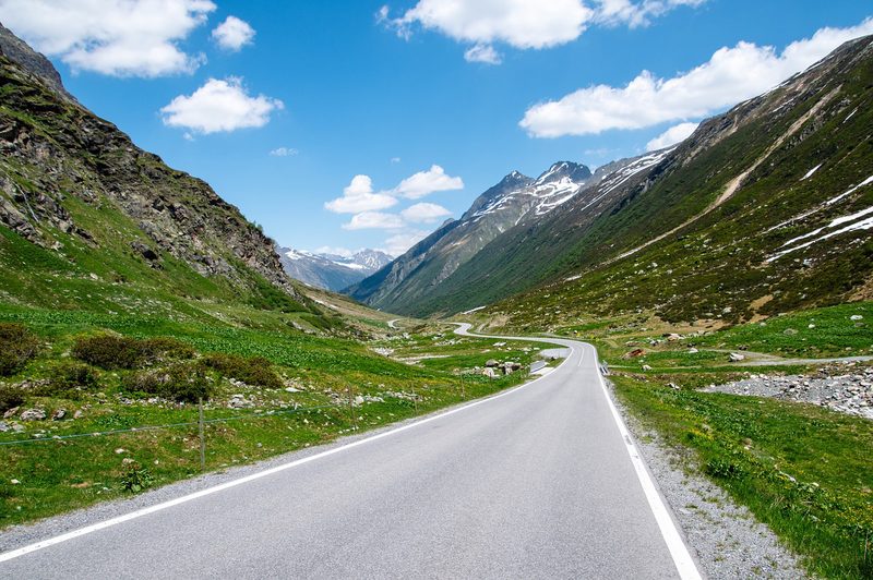Paved road heading up into the mountains.