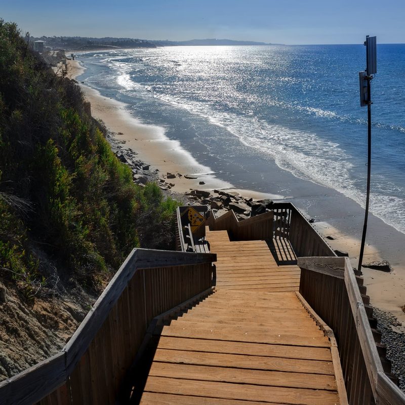 A set of stairs leading down to the beach