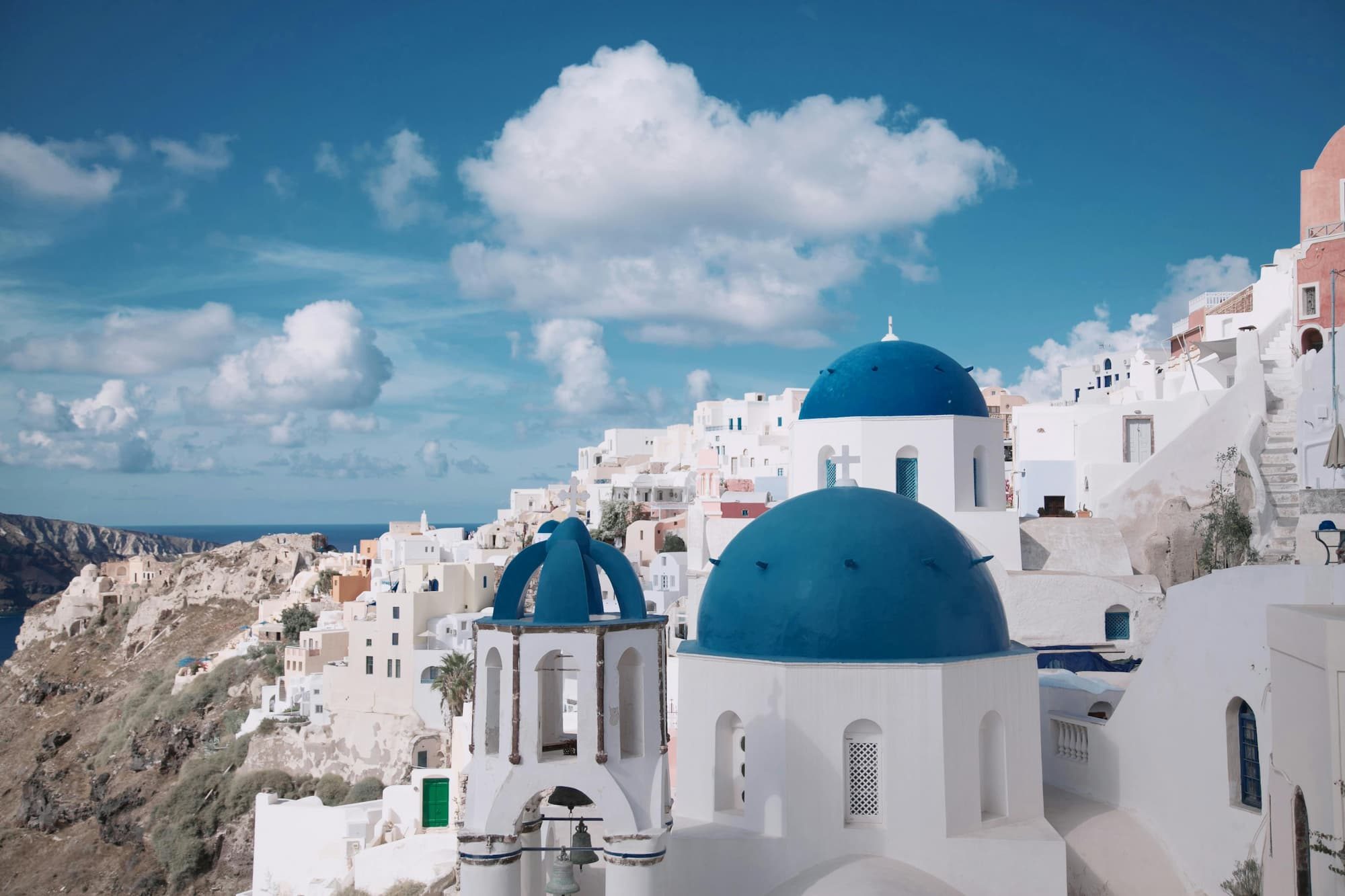 white buildings with blue domed roofs