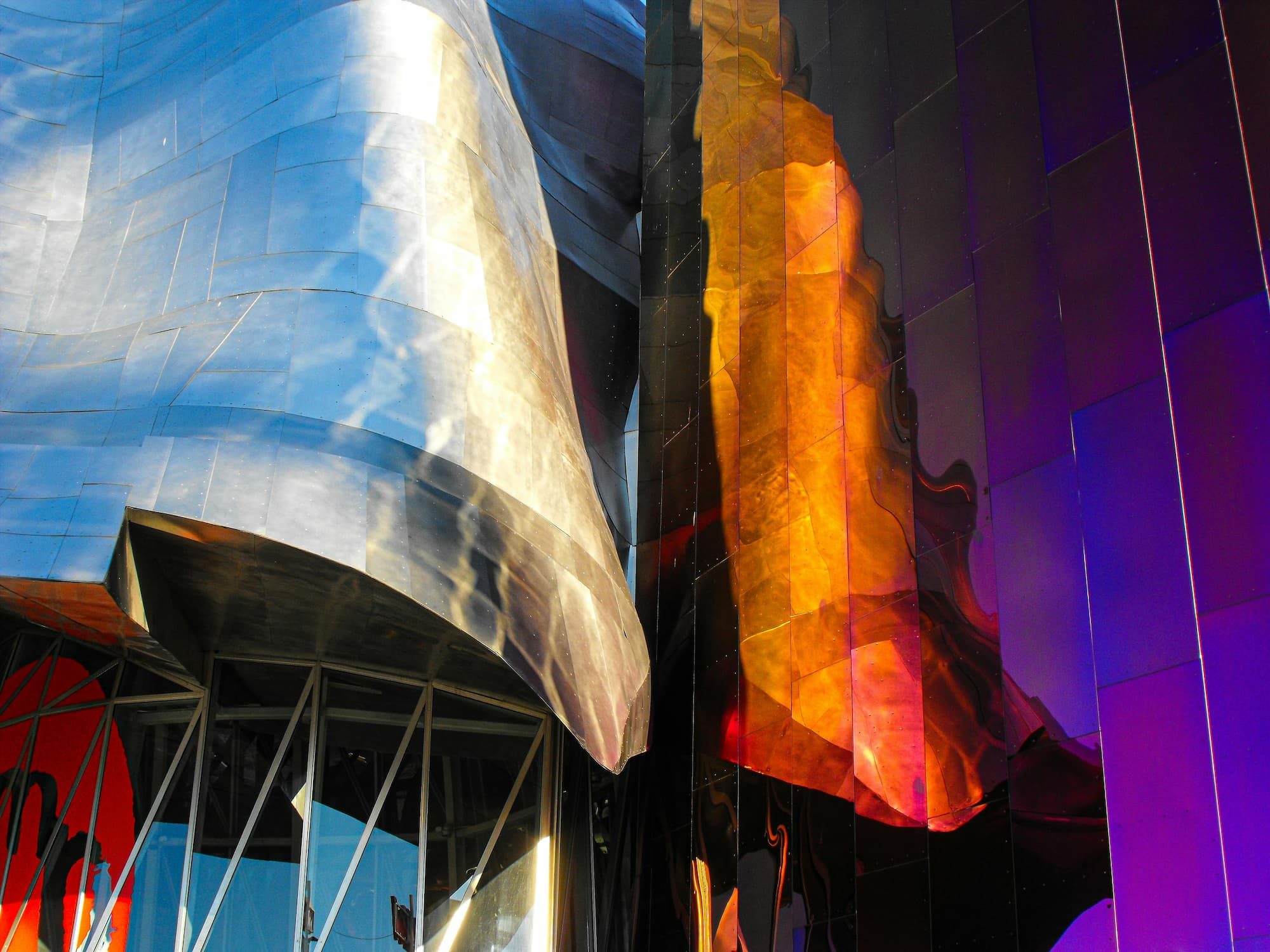 outside of a building with blue, silver, orange, and purple colors