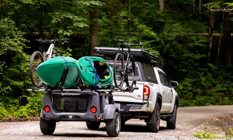 SylvanSport's 2025 Micro Adventure Series line-up mounted to a white Toyota Tacoma pickup truck
