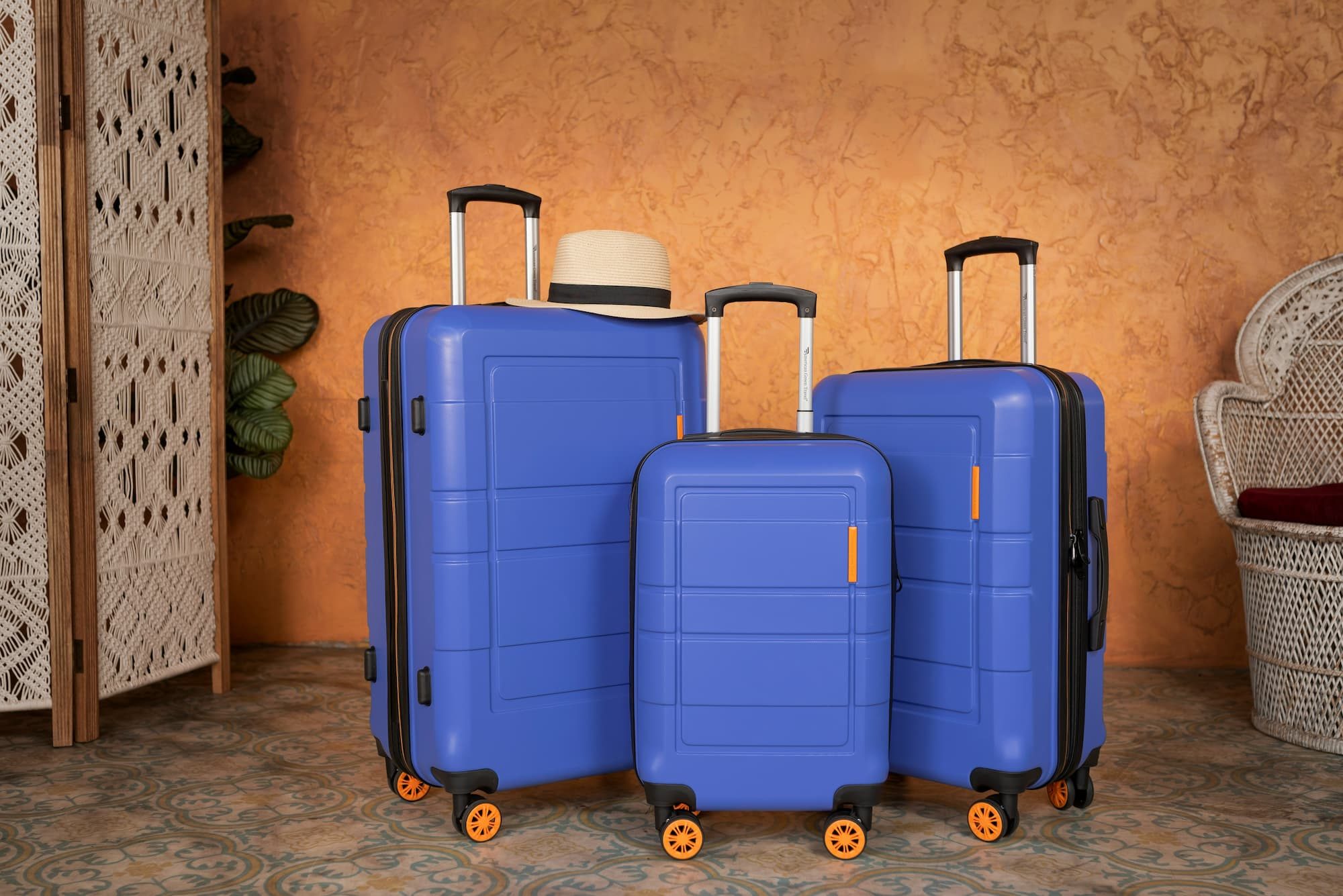 three pieces of blue luggage next to each other