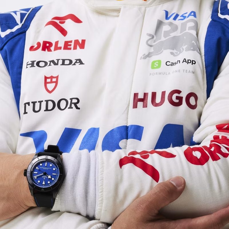 Formula 1 race car driver wearing the Tudor Black Bay Ceramic "Blue" watch