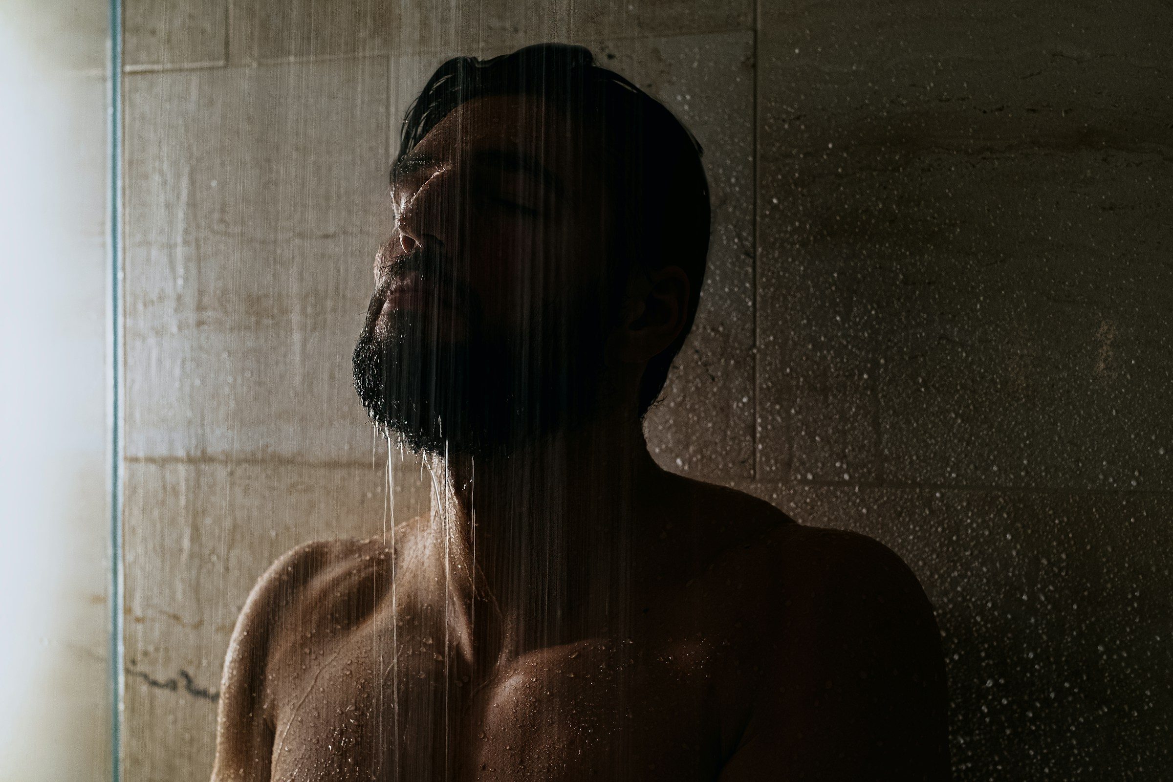 man in shower close up water beard
