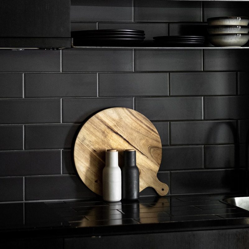 Sleek, black interior finishes of War Horse All-Terrain's custom camper vans.