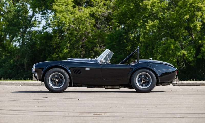 1963 Shelby 289 Cobra driven by Steve McQueen left profile view.