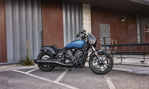 2025 indian scout ready for second century motorcycle sport parked in front of a warehouse right three quarter view